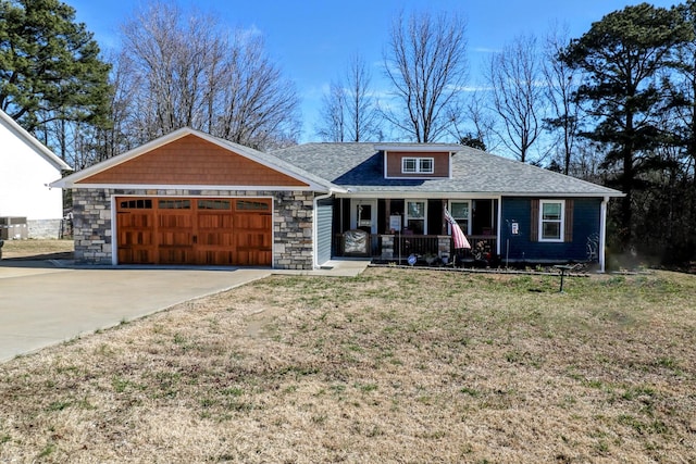 ranch-style house featuring driveway, a garage, stone siding, a porch, and a front yard