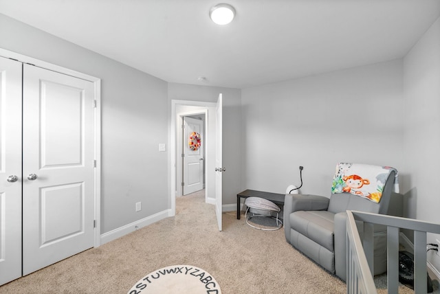 bedroom with light carpet and baseboards