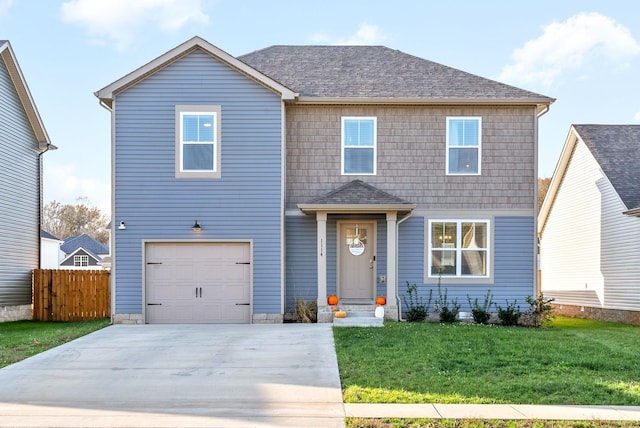 traditional home with a garage, fence, concrete driveway, roof with shingles, and a front yard