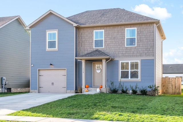 view of front of house with a shingled roof, a front yard, entry steps, a garage, and driveway