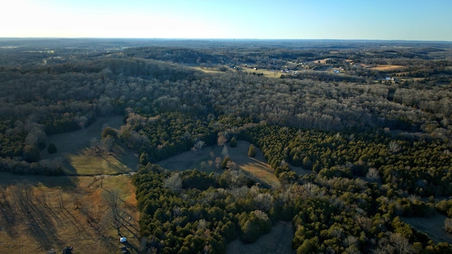 birds eye view of property with a wooded view