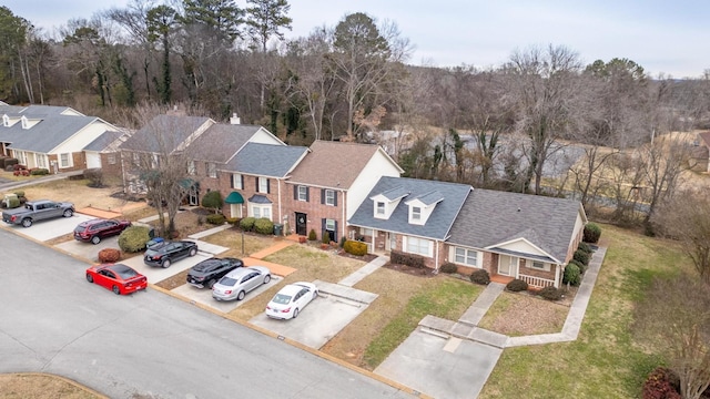 bird's eye view with a residential view and a view of trees