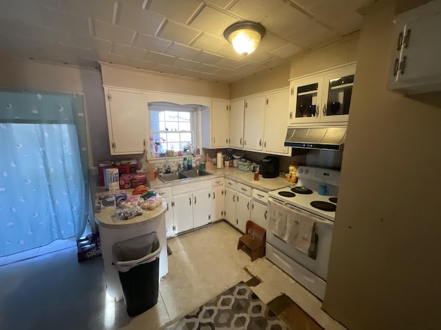 kitchen featuring light countertops, white electric range, under cabinet range hood, and white cabinetry