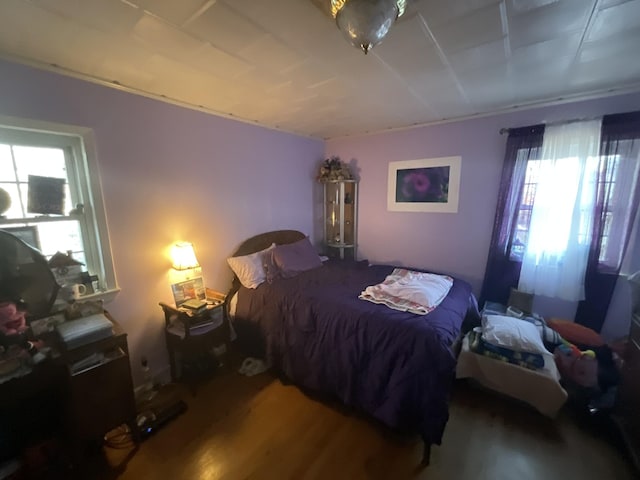 bedroom with wood finished floors