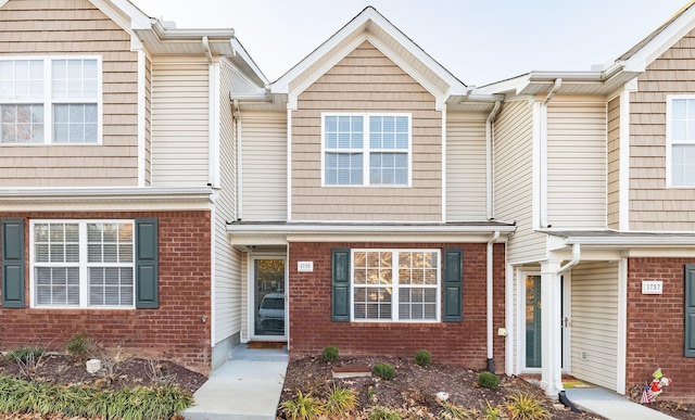 view of property with brick siding