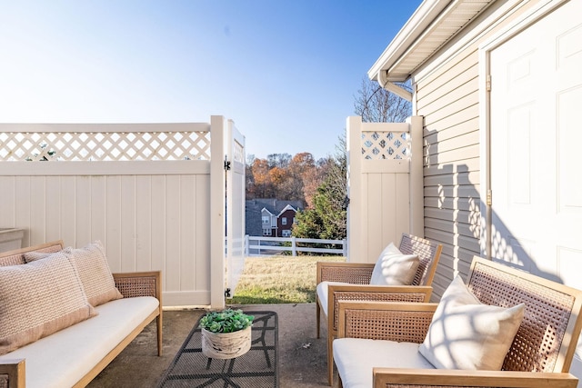 view of patio with fence and an outdoor hangout area