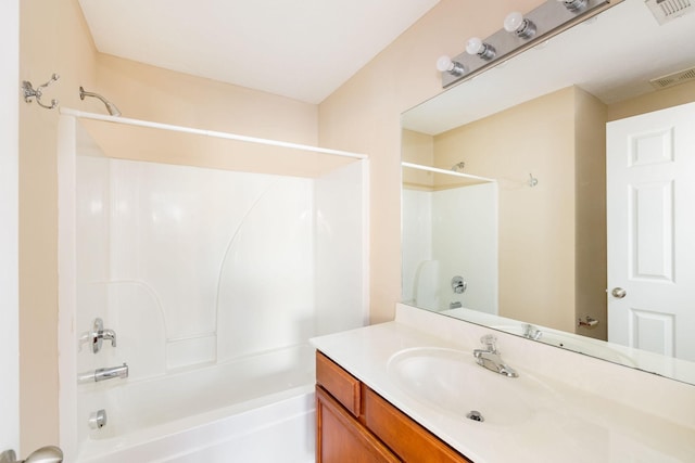 bathroom with visible vents, shower / bathing tub combination, and vanity