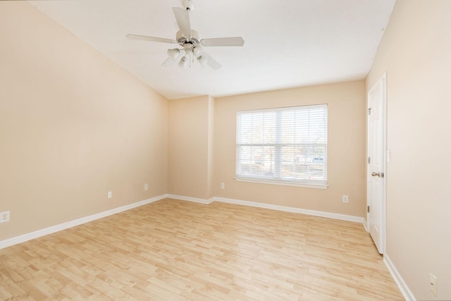 empty room featuring light wood-type flooring, ceiling fan, and baseboards