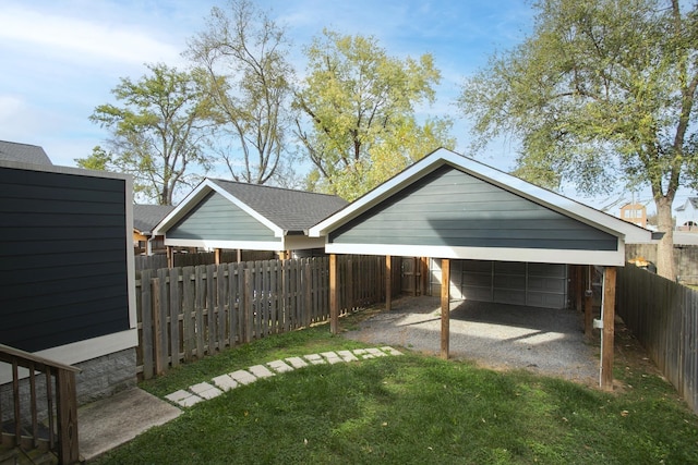 view of yard with a garage and fence