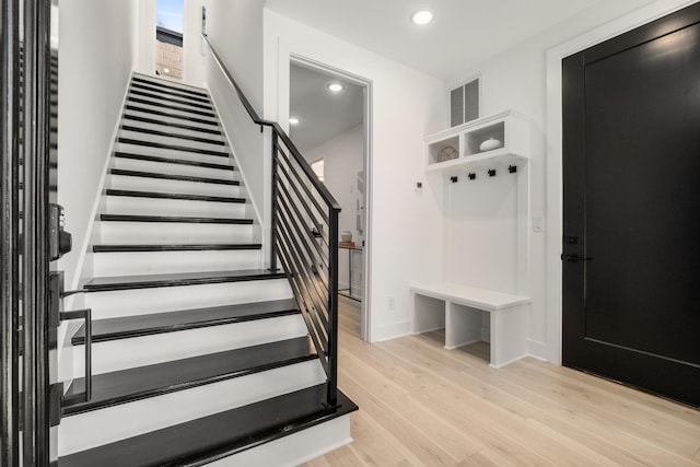 mudroom featuring light wood-style flooring, visible vents, and recessed lighting