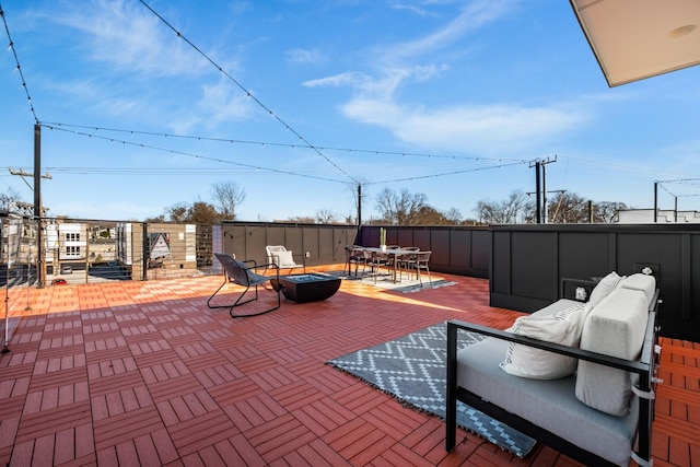 view of patio / terrace with an outdoor fire pit