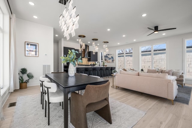 dining room with recessed lighting, visible vents, and light wood-style flooring