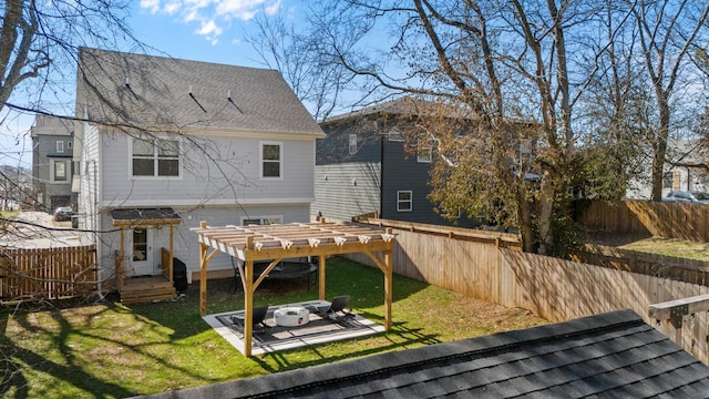 back of house featuring a fenced backyard, a lawn, a pergola, and roof with shingles