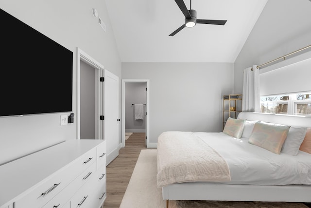 bedroom featuring visible vents, light wood-style flooring, ceiling fan, high vaulted ceiling, and baseboards