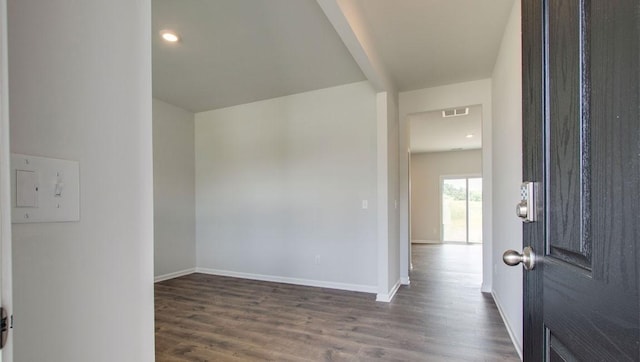 entryway featuring dark wood-style floors, visible vents, and baseboards