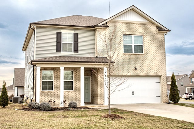 traditional-style home with central AC, brick siding, an attached garage, and driveway