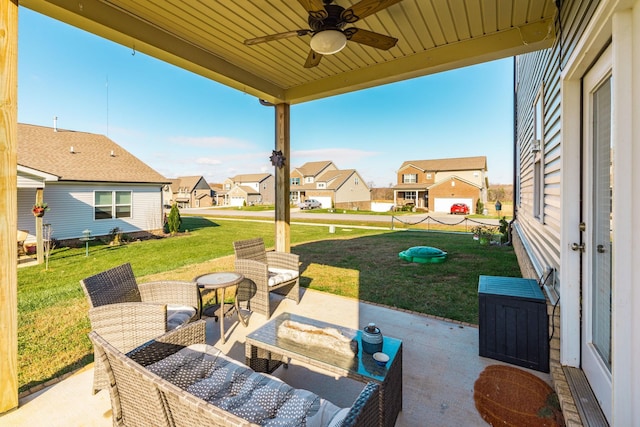 view of patio with a residential view, outdoor lounge area, and ceiling fan