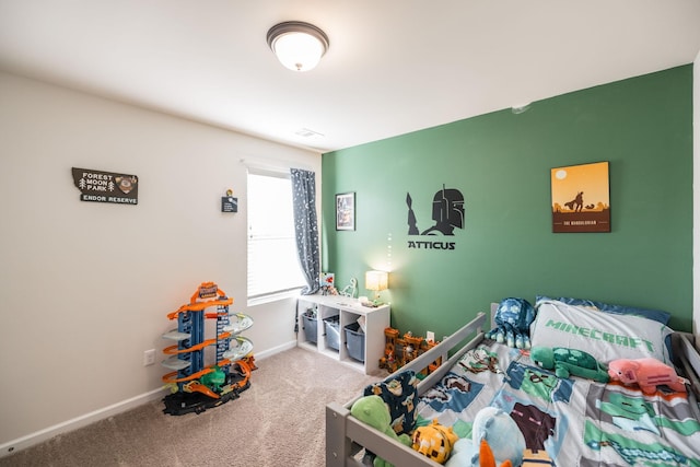 carpeted bedroom with baseboards