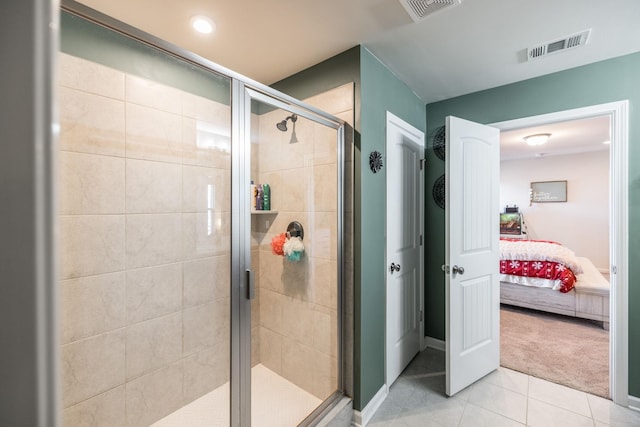 ensuite bathroom featuring a stall shower, visible vents, connected bathroom, and tile patterned floors