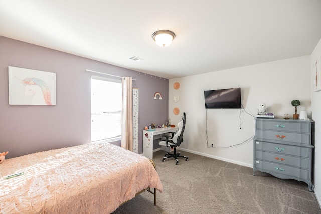 bedroom with carpet floors, visible vents, and baseboards