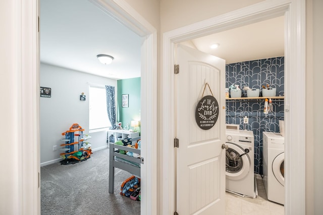 laundry area featuring laundry area, baseboards, washer and clothes dryer, carpet, and wallpapered walls