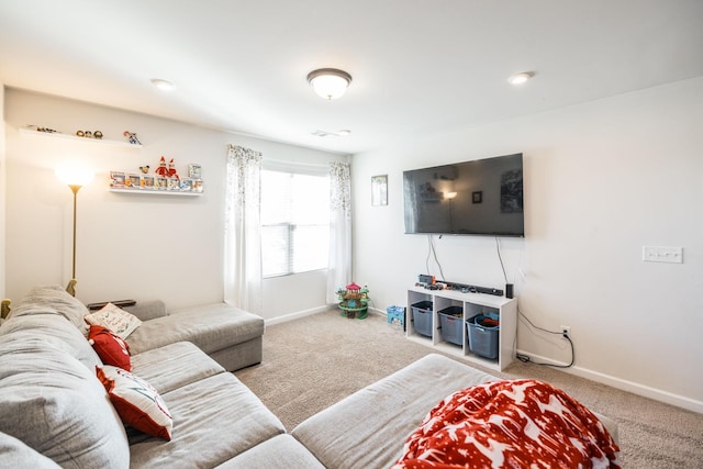 carpeted living area featuring baseboards