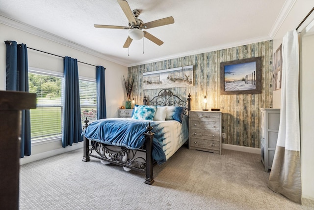 carpeted bedroom with ceiling fan, ornamental molding, a textured ceiling, and baseboards