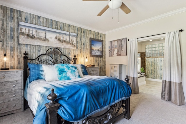 carpeted bedroom featuring baseboards, a ceiling fan, and crown molding