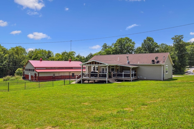 rear view of property with stairs, a yard, a wooden deck, and fence