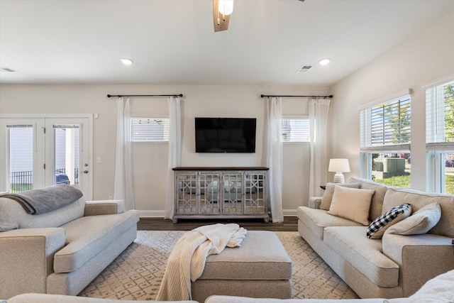 living area featuring recessed lighting, baseboards, visible vents, and light wood finished floors