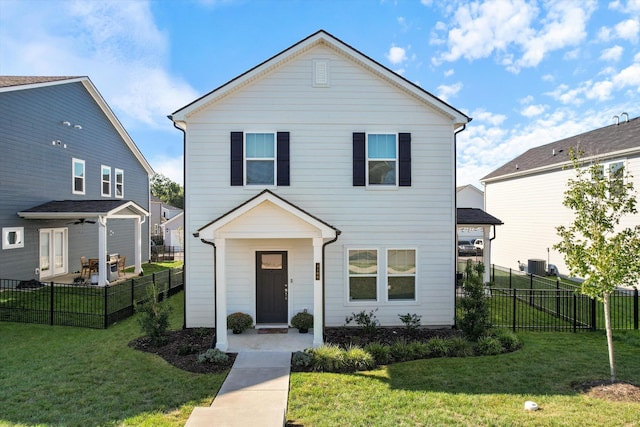 traditional home featuring fence private yard and a front yard