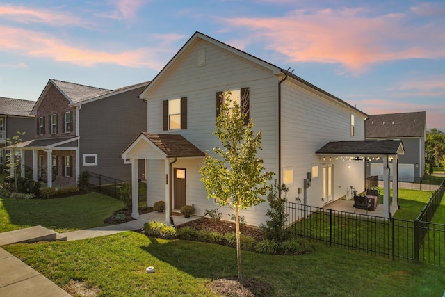 4108 Crimson Hop Dr, Antioch, TN 37013 - view of front of property featuring a patio area, a fenced backyard, and a front lawn