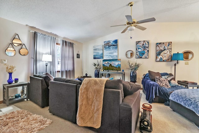 living area with light colored carpet, vaulted ceiling, a textured ceiling, and ceiling fan