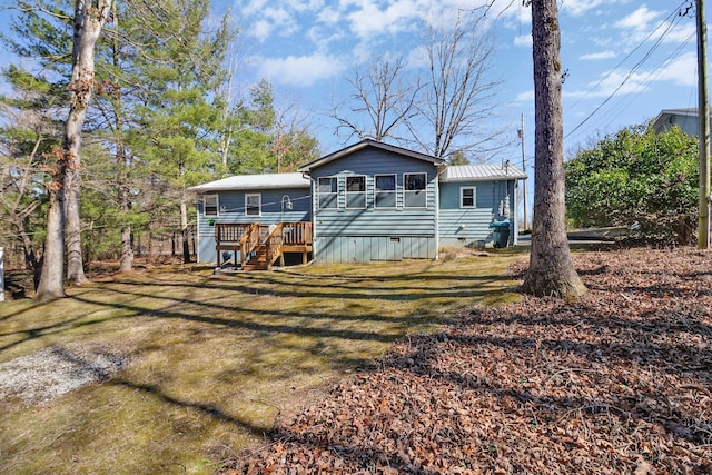 back of property with crawl space, stairs, a deck, and a lawn