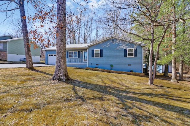 ranch-style house featuring a garage, metal roof, crawl space, and a front yard