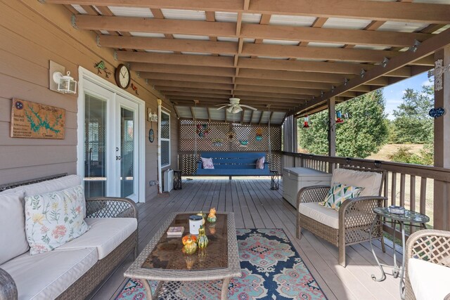 wooden deck with french doors and outdoor lounge area