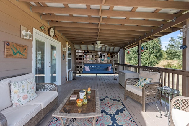 wooden deck featuring an outdoor hangout area and french doors