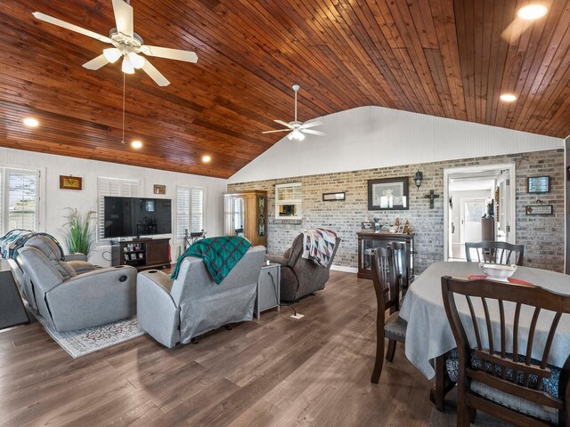 living area featuring lofted ceiling, wooden ceiling, brick wall, and wood finished floors