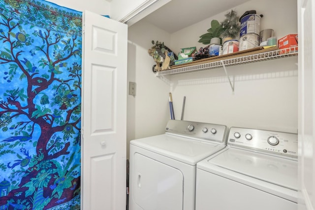 laundry room with laundry area and washing machine and clothes dryer