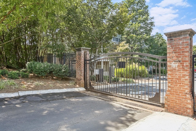 view of gate featuring fence