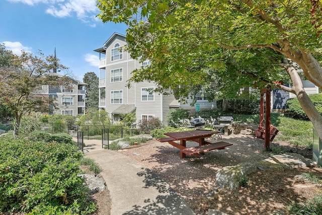 view of home's community with fence