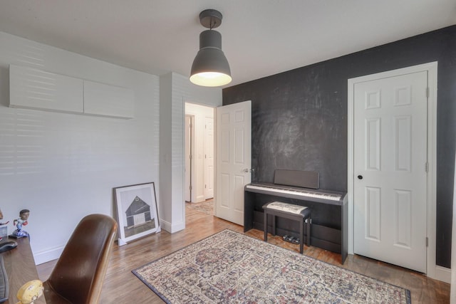 office featuring wood finished floors and baseboards