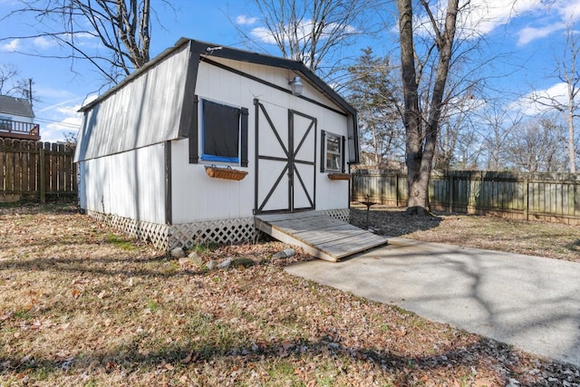 view of outbuilding featuring an outbuilding and a fenced backyard