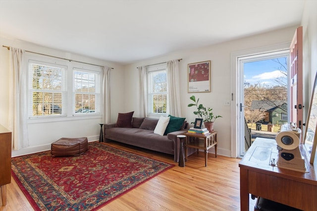 sitting room with light wood-style floors and baseboards