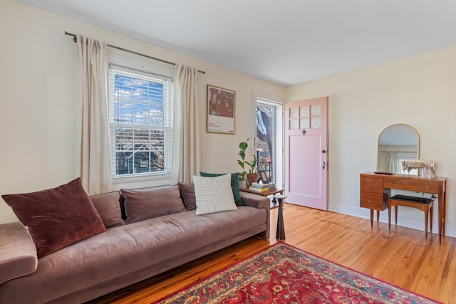 living room featuring baseboards and wood finished floors