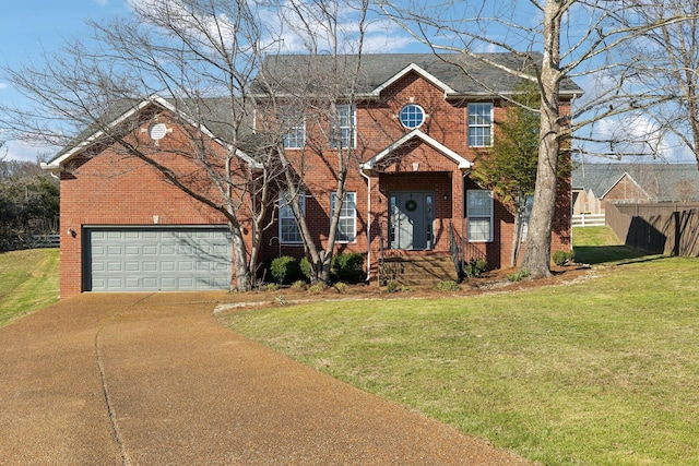 colonial house featuring a garage, brick siding, concrete driveway, fence, and a front yard