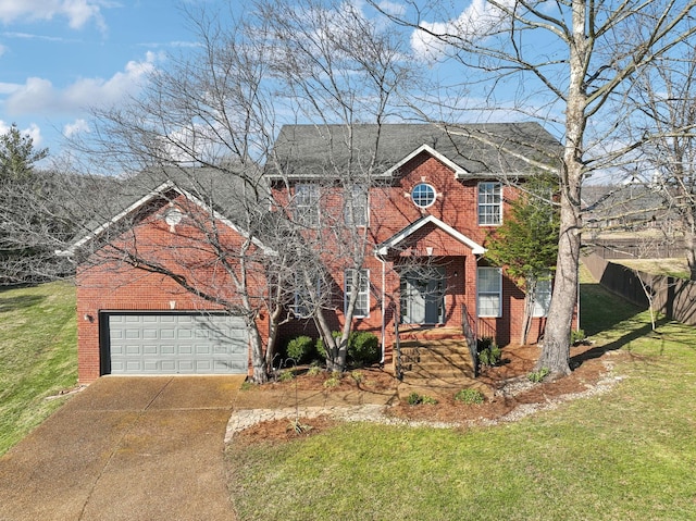 colonial-style house featuring concrete driveway, brick siding, and a front lawn