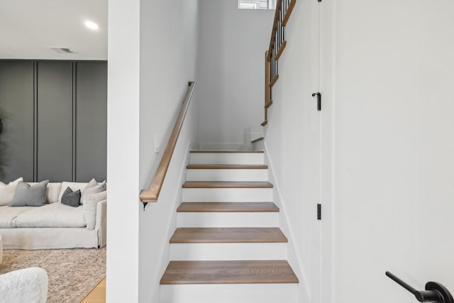 stairway featuring recessed lighting