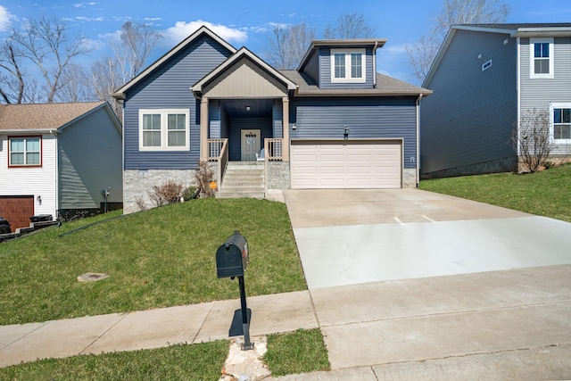 view of front of property with a front lawn, stone siding, a garage, and driveway