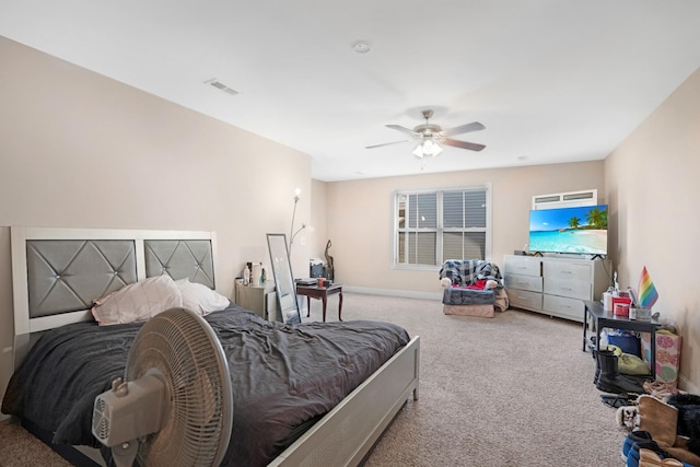 bedroom featuring carpet flooring, a ceiling fan, visible vents, and baseboards